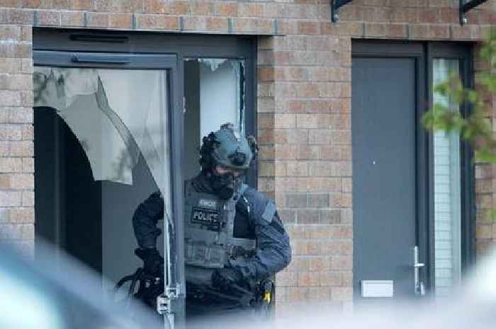 Six men charged after gang war cops storm houses in dawn raids as feud escalates