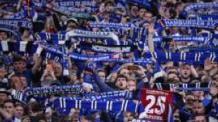 Hamburg pitch invasion hospitalises 25 fans