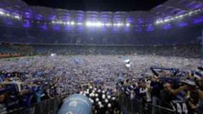 Hamburg pitch invasion hospitalises 25 fans