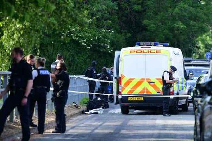 Man shot by armed police after man and woman seriously injured in double stabbing