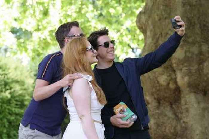 Fans take selfies with 'Tom Cruise' as he eats cocktail sausages in London park - only for it to be his movie stand-in