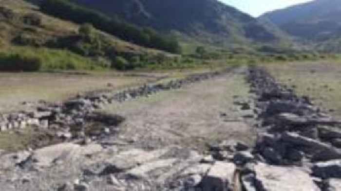 Flooded village re-emerges in dry spell