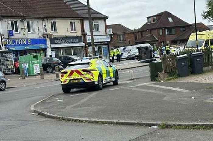 Woman 'seriously injured' as car overturns in rush hour crash