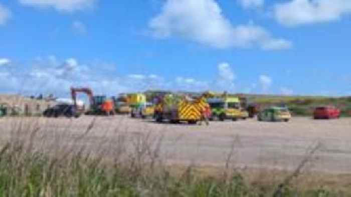 Paraglider pilot in his 70s injured on coast