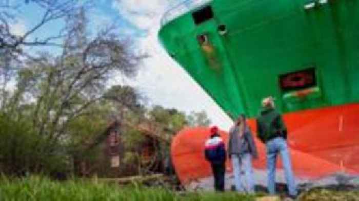 Man in Norway wakes to find huge container ship in garden
