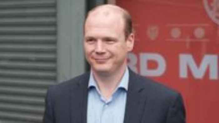 DUP communities minister at first senior GAA game