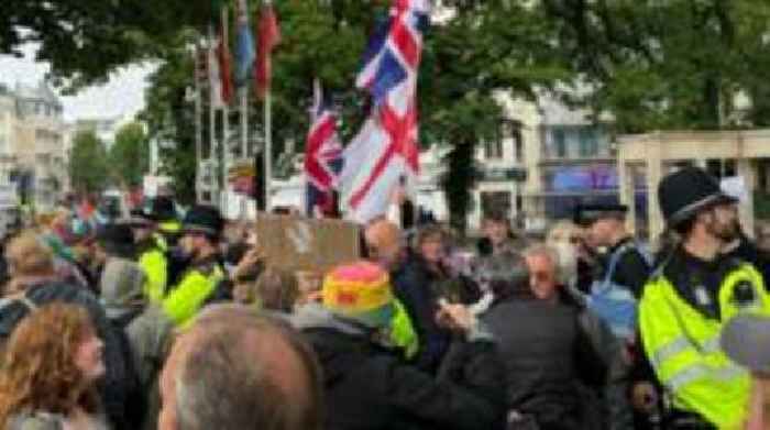 Protest groups separated by police in city centre
