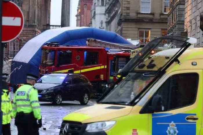 Liverpool parade disaster: Emergency crews lift car to free child and three others