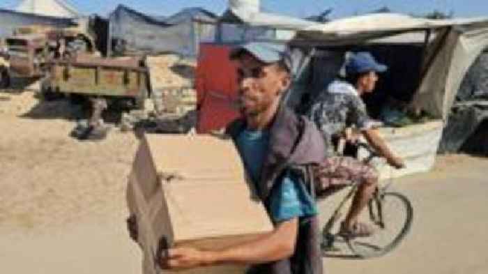 Controversial US-backed group says it has begun aid distribution in Gaza