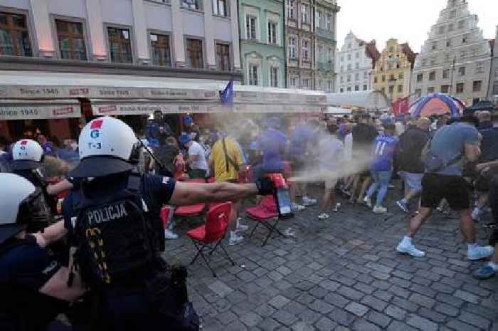 Chelsea and Real Betis fans 'throw bottles and smoke grenades' as they clash in the streets