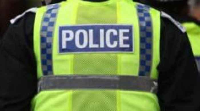 Woman charged with attempting to murder two police