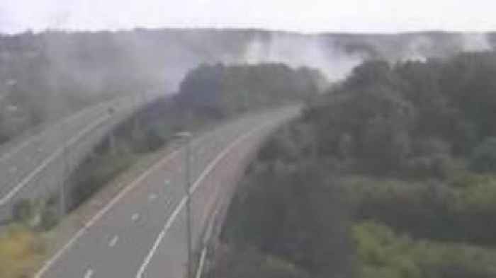 Motorway traffic affected by smoke from nearby fire