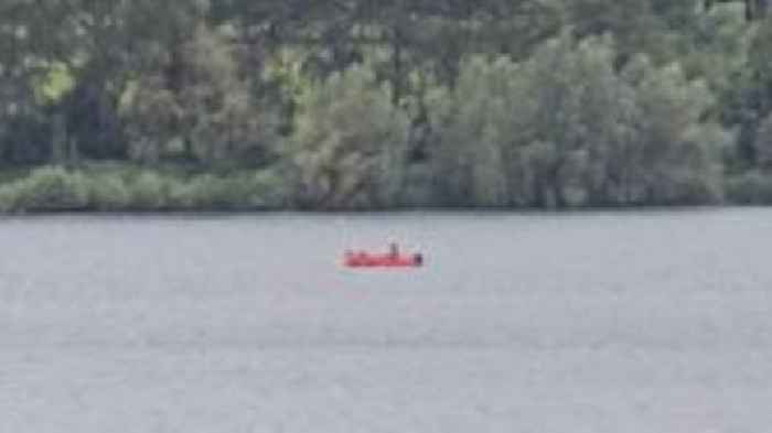 Dad missing after capsizing on reservoir with son
