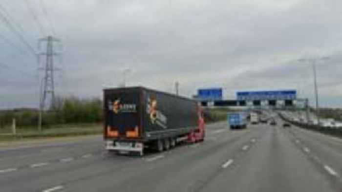 Appeal after driver standing by van dies on M1