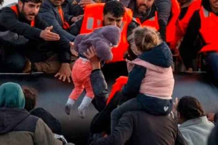 'Scandal' of new migration photos as French police watch asylum seekers board boats to UK