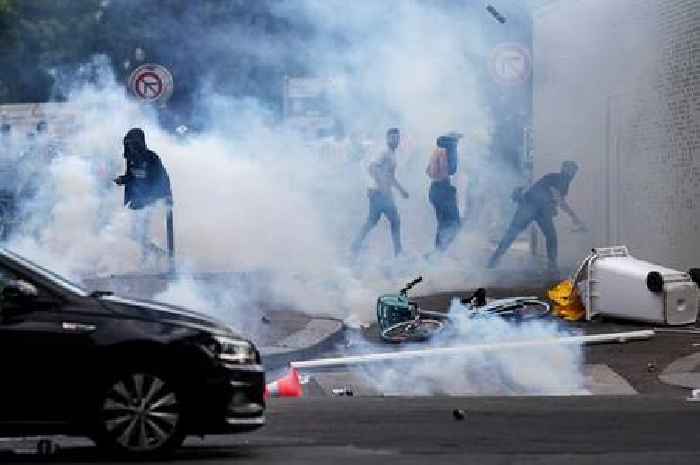 Police clash with PSG yobs at Champions League parade on second day of chaos