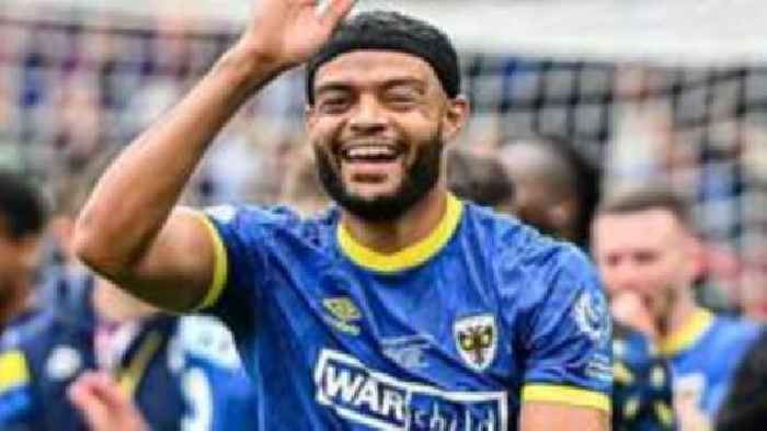 Wimbledon defender Johnson signs new contract