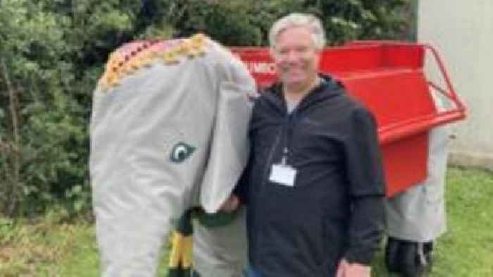 Mechanical elephant being fixed for summer fete