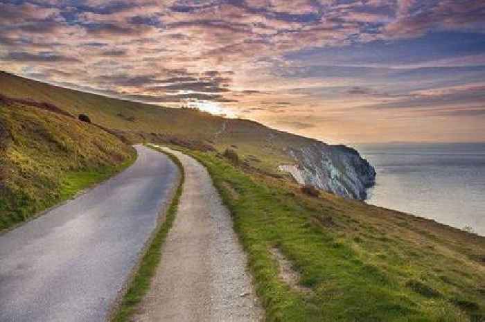 Two die as car plunges off cliff into sea at popular UK beauty spot