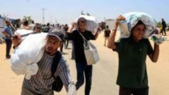 Palestinians say local gunmen and Israeli forces opened fire near Gaza aid site
