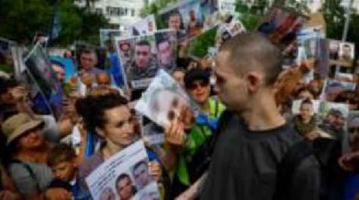 Families of missing Ukrainians gather as prisoner exchange begins
