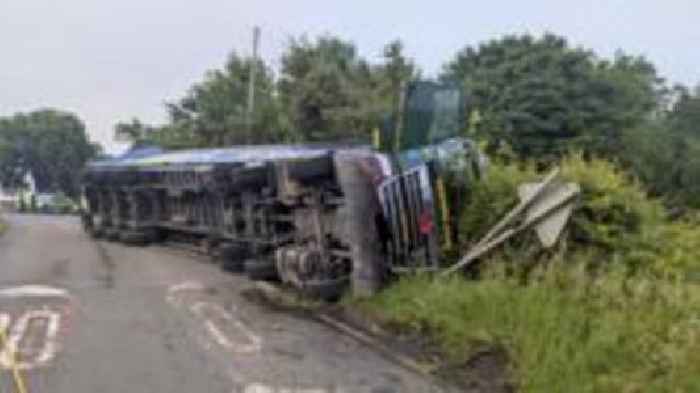 Road closed 'for some time' after lorry overturns