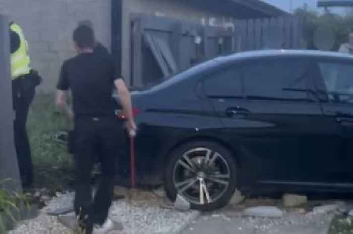BMW driver smashes into Edinburgh garden as terrified kids take cover in house