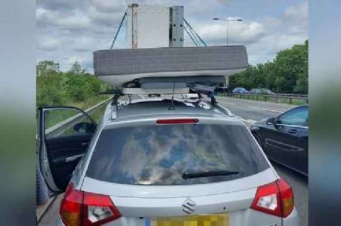 Car caught driving on M11 with fridge, mattress and table on roof