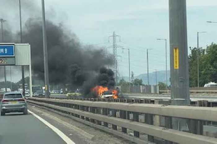Car bursts into flames on M8 as firefighters battle to control blaze