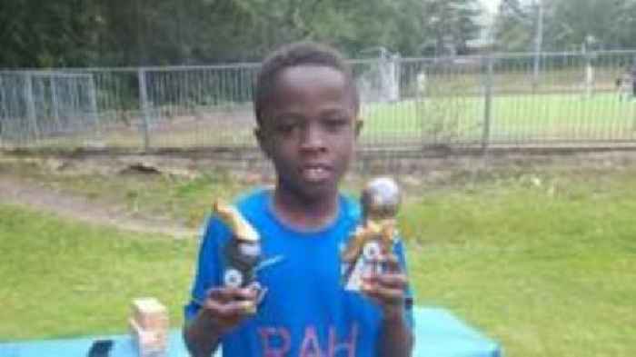 Vigil for boy who died after M4 minibus crash