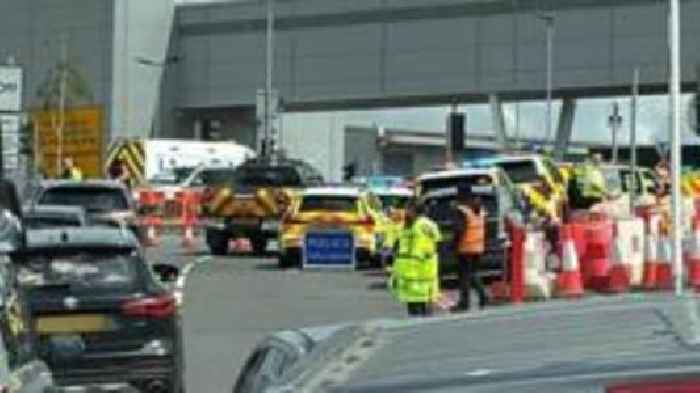 Man hurt after vehicle falls from airport car park