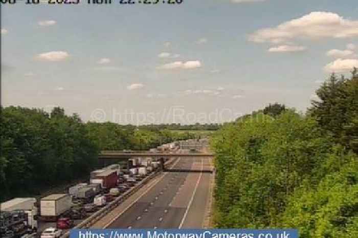 Live M11 crash updates as lorry overturns after crossing central reservation causing severe delays