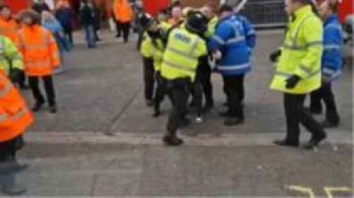 Police officer sacked for hitting football fan