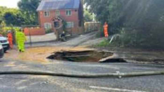 Sinkhole closes busy route after water main burst