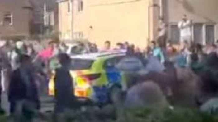 Police attacked after vigil for teen crash victim