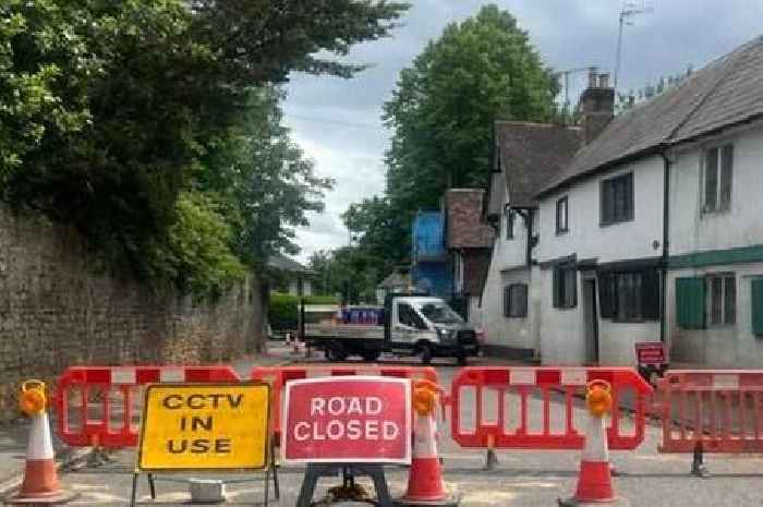 Reopening of key Surrey village road closed since lorry hit listed building now in sight