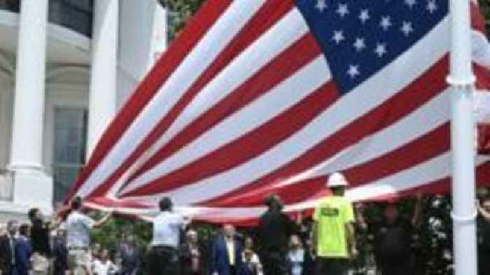Watch: Trump installs enormous US flags at the White House