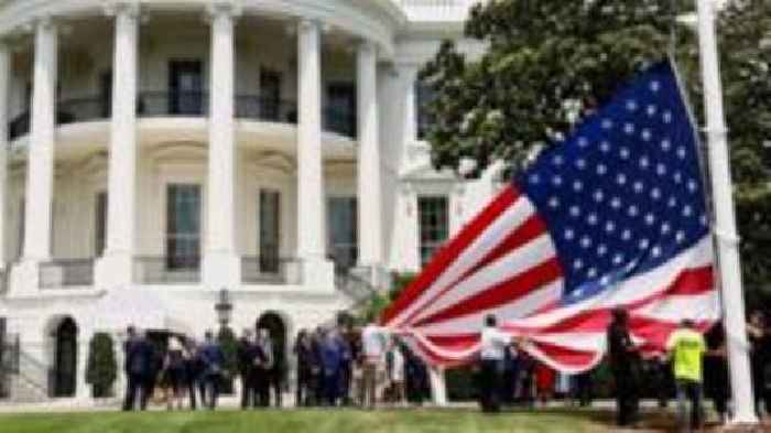Watch: Donald Trump installs enormous US flags at the White House