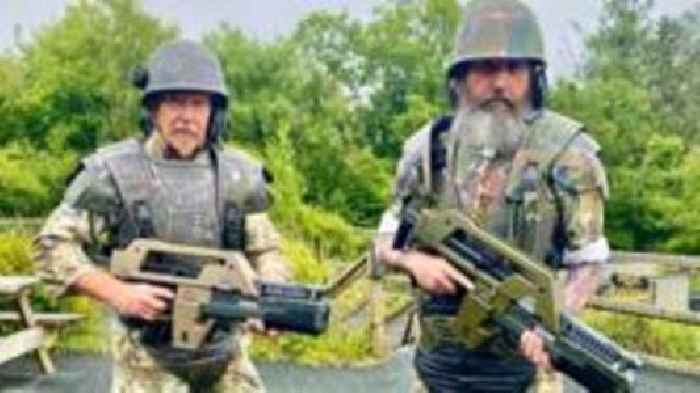 Duo take on zip wire dressed in space armour