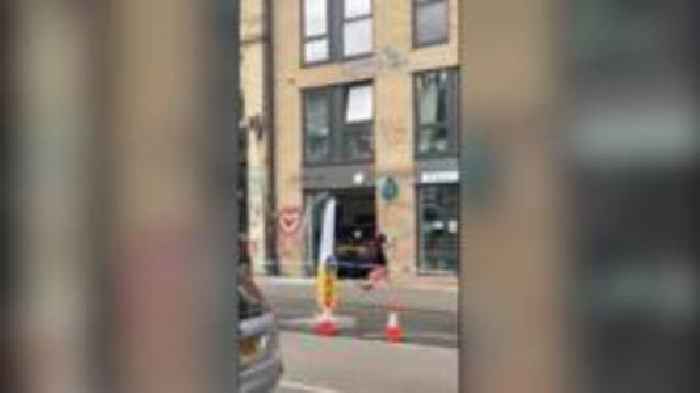 Car smashes through pizza restaurant's front window