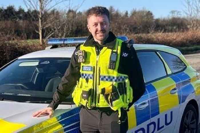 Police officer rescues driver trapped in car fire just moments before explosion