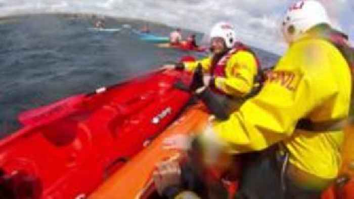 The moment 18 kayakers were rescued from the sea