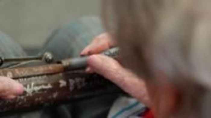 WW2 rifle signed by 104-year-old veteran cook