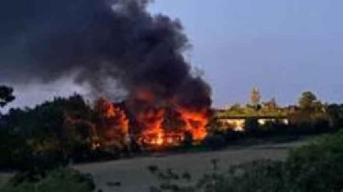 Lorries at waste site set on fire 'deliberately'