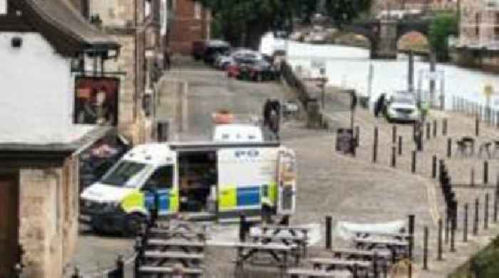 Woman arrested after man's body found in river