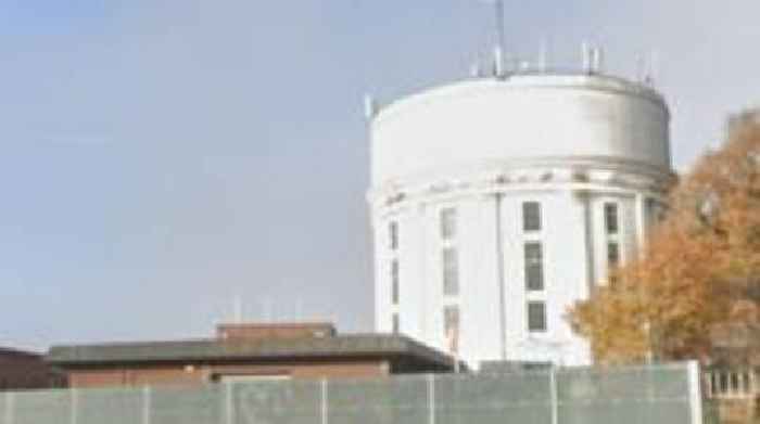 Man arrested after body found near water tower