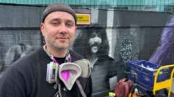 Artist's surprise gift as Black Sabbath visit mural