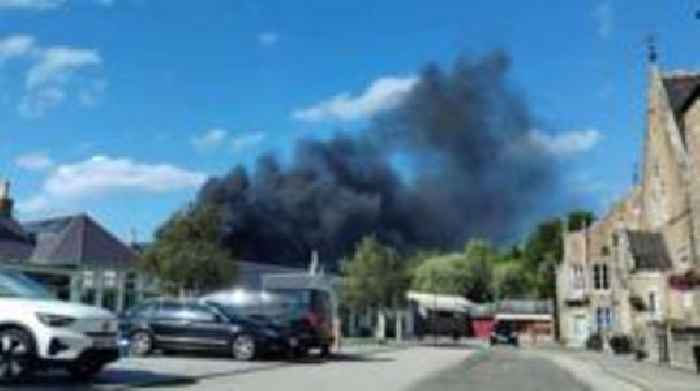 Homes evacuated as firefighters tackle house blaze