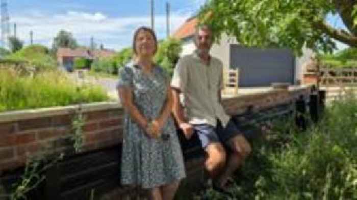 Couple use crash barrier to stop cars hitting home