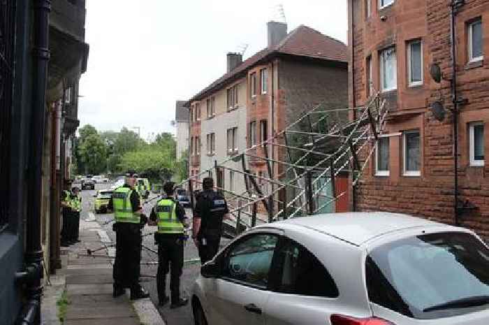 Scaffolding collapses and smashes window after falling into building on Scots street